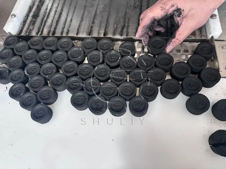 Logo-embossed charcoal tablets